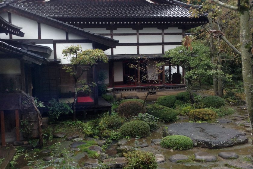 The temple's architecture blends harmoniously with the garden.