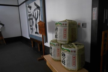 <p>Large sake barrels in the entrance hall</p>