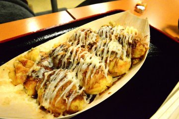 <p>Cheese Takoyaki from the Osaka Kukuru stall. Squishy insides with fresh octopus!&nbsp;</p>