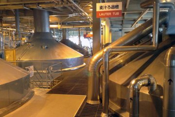 <p>Take a look through the windows to see fermentation, cooling, and storage tanks along the tour.&nbsp;</p>