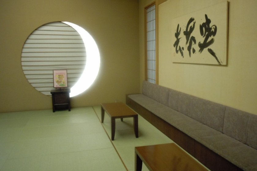 This is the reception area at the entrance. To the left, you will find the reception desk and a display of small Japanese souvenirs for sale