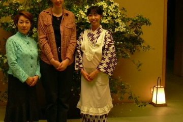 <p>This photo was taken during my first visit to the restaurant. I am in the center;&nbsp;that&#39;s my student on my left, and our server on my right. I include it so that you can see the server&#39;s kimono</p>