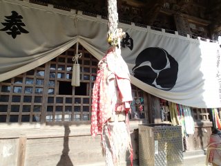 Bell rope in front of Main Hall with bibs to pray for the safety of children