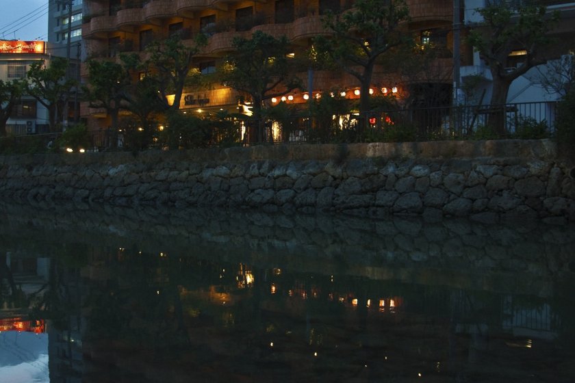 Reflection of the Hotel Sun Palace Kyuyoukan over the canal
