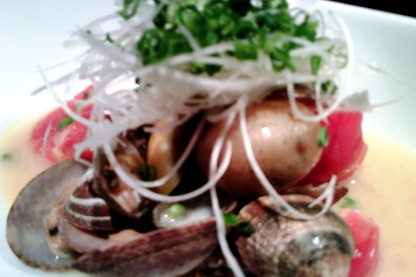 Clams with butter broth and daikon radish and spring onion