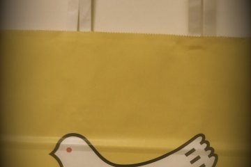 A yellow paper bag with a cute dove logo on the side and dove-shaped cookies inside is a typical Kamakura souvenir.  Almost all school kids coming to Kamakura on class trips have it!